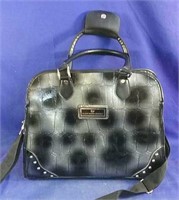 Gloria Vanderbilt purse grey/black in color,
