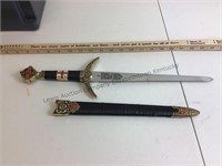 Toledo Ornate ceremonial dagger with scabbard .