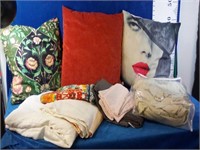 Assortment of pillows and bedding