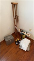Wooden crutches, two wooden canes metal storage
