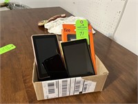 2 Amazon tables, LG phone, short internet cable
