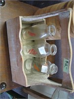 Wooden crate with dairy bottles