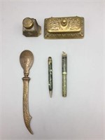 Brass desk set with letter opener pens and inkwell