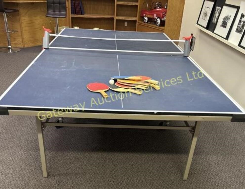 Ping pong table with paddles