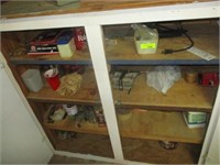 All contents in bottom of large white cabinet