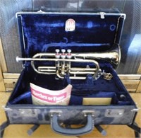 Conn brass cornet in velvet lined case w/ music