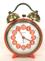 Small orange metal vintage Linden alarm clock