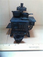 Toy queen wood stove with pots and pan