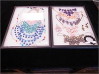 Two containers of colored costume jewelry,