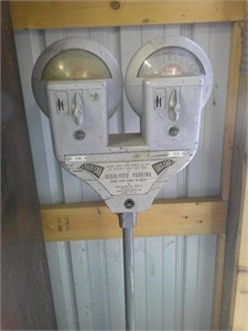 dual parking meter on steel stand