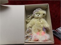 Collectible bear co teddy bear in box.