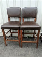 Two faux leather Upholstered bar stools 17"W x