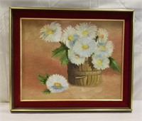 Painting of flowers on a canvas board