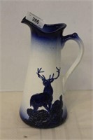 TALL CERAMIC WALL PITCHER WITH BUCK