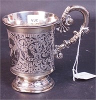 A 5" etched silver-handled cup with black etched