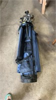 Golf club bag including golf clubs.