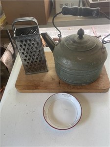 Wooden cutting board, tea kettle, grater, enamel