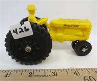 Plastic yellow tractor w/driver, signed, 40 years