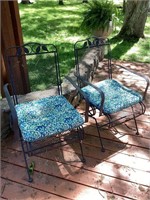 Two wrought iron chairs