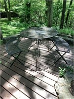 Wrought iron table and three benches