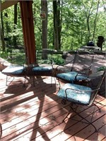 Four wrought iron chairs