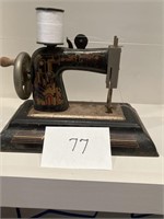 Child's tin sewing machine with working parts