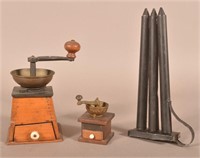 Two Coffee Mills and a Tin 3-Tube Candle Mold.