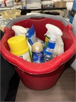 RED SCRUB BUCKET WITH PARTIAL BOTTLES OF