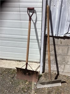 Two metal snow shovels