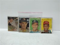 4 vintage baseball cards in plastic sleeves