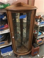 Oak corner curio cabinet w/curved glass