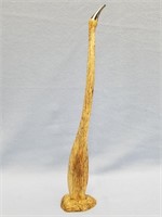 Fossilized whale bone carving of a bird, 17" long