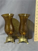 Pair of brass candleholders with glass shades