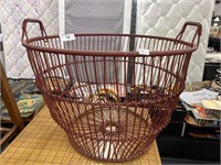 Primitive weaved metal gathering basket.