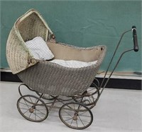 Wicker baby buggy with vintage feather ticking