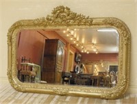 Torch and Swag Crowned Gilt Framed Beveled Mirror.