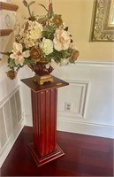 wooden pedestal with floral