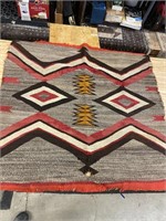 Antique Navajo rug has had some repair. 40” x 38”