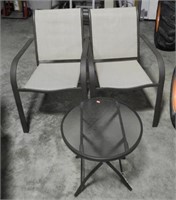 Pair of patio chairs and glass top table