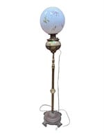 Floor lamp on brass and cast iron base with hand