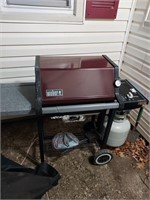 Weber outdoor grill with cover