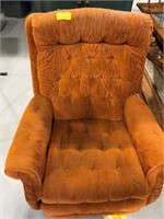 ORANGE UPHOLSTERED ROCKING CHAIR