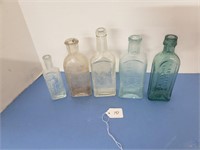 5 APOTHECARY BOTTLES SOME EMBOSSED
