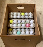 Eight dozen assorted golf balls. All are in egg