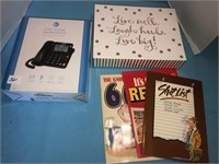 New phone in box, greeting cards, books
