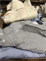 Box of long sleeve button up shirts . 
Jones New