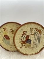 Set of two Decorated terra cotta plates