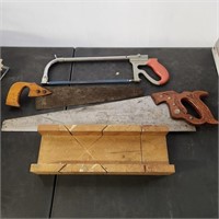 3 hand saws and miter box