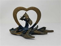 Brass heart and dolphins sculpture