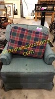 Green chair with pillow